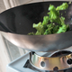 Illustration for article titled Using the WokMon to Achieve Expert-Level Chinese Food at Home